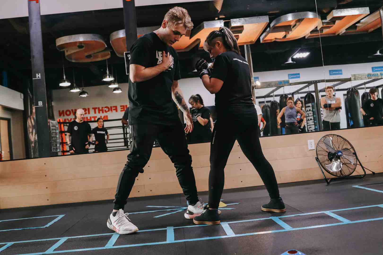 Expert trainer giving one-on-one instruction during class